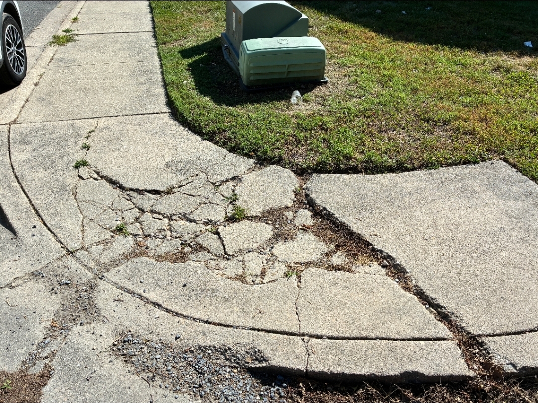 Before: a map-cracked, heaved sidewalk section on the Eastern Shore that had failed down to the base